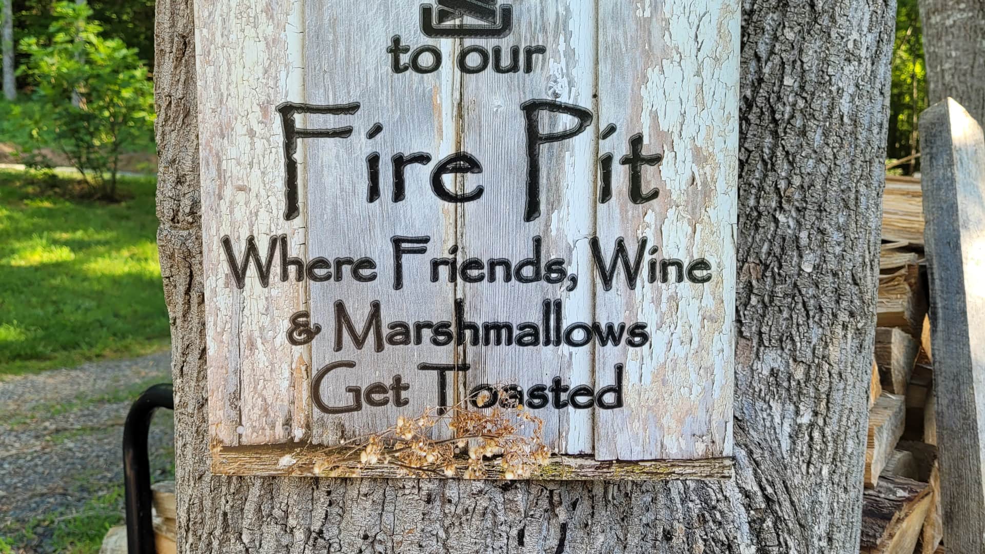 Campground with fire pit and mountain views at Candy Mountain Goat Farm in Murphy, NC