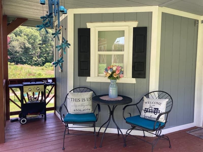 Cozy tiny home cabin rental surrounded by trees at Candy Mountain Goat Farm in Murphy, NC